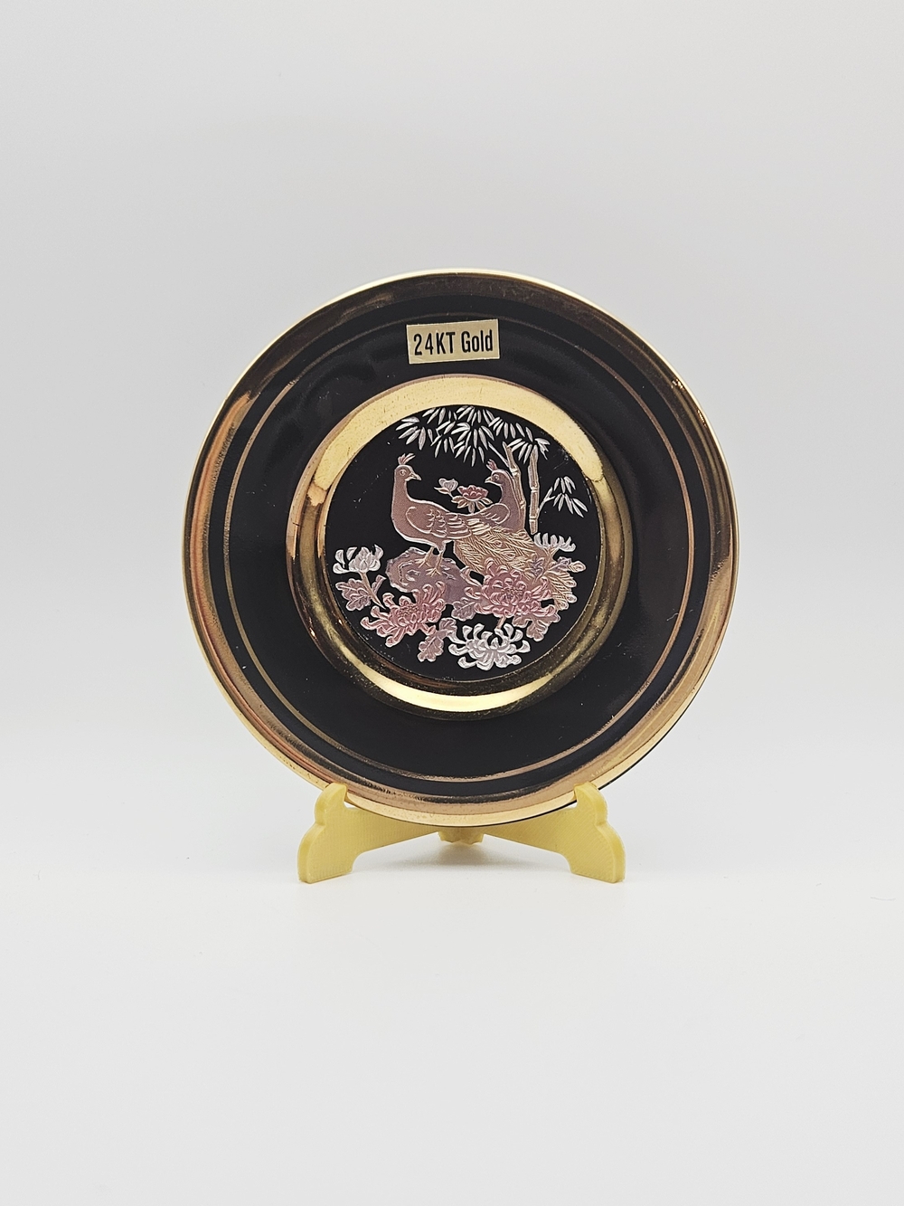 "The Art of Chokin" Japanese collector plate featuring engraved peacock designs